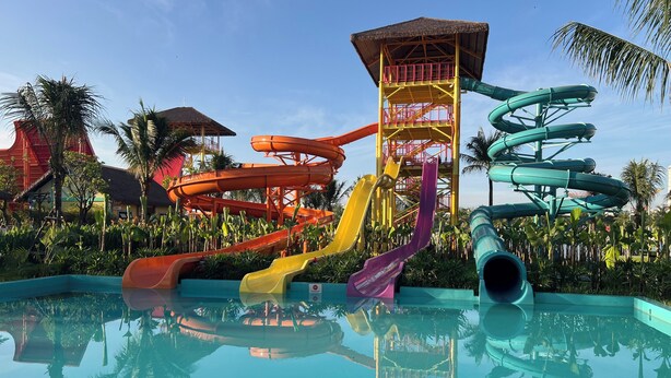 A water park with multiple slides and a pool. - Vinhomes Grand Park-Masterise Center (Ho Chi Minh City)