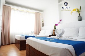 Family Quadruple Room, City View | Desk, laptop workspace, soundproofing, free WiFi - Star Hotel (Davao)