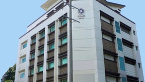 A multi-story hotel building with a modern design, featuring a prominent logo and the name "STAR HOTEL" on the facade. - Star Hotel Davao (Davao)