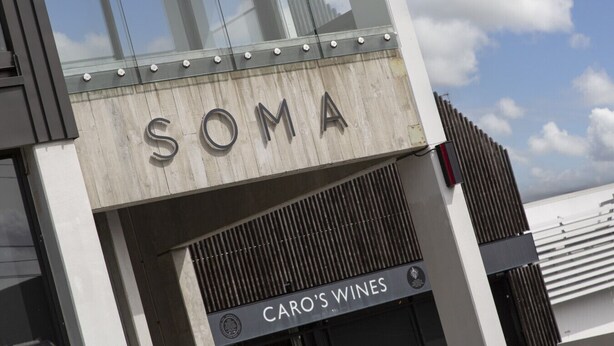 A building with a sign that reads "SOMA" and "CARO'S WINES" below it. - Solara by Homello | Spacious, Peaceful, Steps to Ponsonby Road (Auckland)