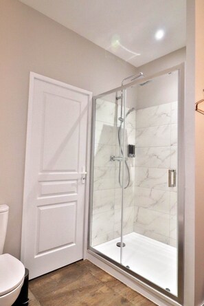 Shower, hair dryer, towels, soap