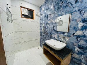 Family Suite, City View | Bathroom | Shower, rainfall showerhead, hair dryer, slippers - Hotel Pilgrim Near Golden Temple (Amritsar)