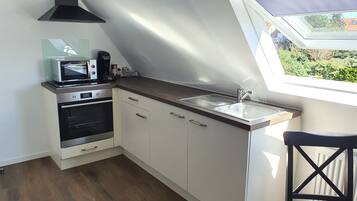 Een magnetron, een oven, een kookplaat