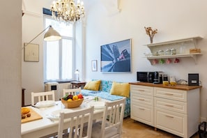 Standard Apartment, 2 Bedrooms (Central Apartment Porta Soprana) | Living area | 21-inch flat-screen TV with cable channels