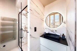 Shower, hair dryer, towels, soap