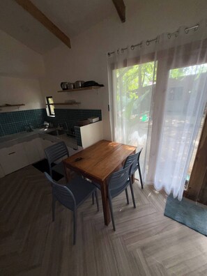 Shared Dormitory, 1 Bedroom, Patio, Garden View | Dining