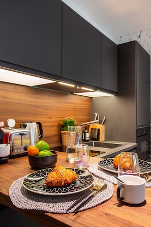 Apartment | Private kitchen | Fridge, microwave, stovetop, dishwasher