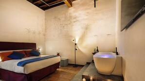A bedroom with a large bed, a bathtub, and a wall with a sketched cityscape.
