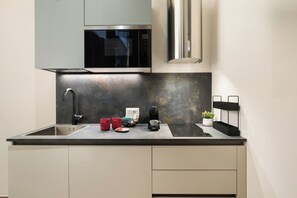 Fridge, microwave, stovetop, coffee/tea maker