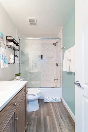 Shower, hair dryer, towels, soap