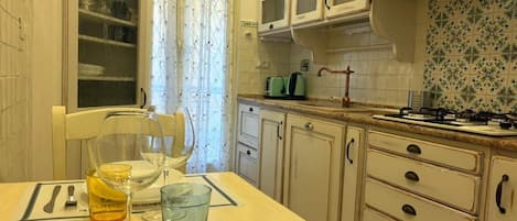 Fridge, microwave, stovetop, cookware/dishes/utensils