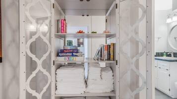Shower, hair dryer, towels, shampoo