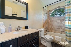 Hair dryer, towels, shampoo, toilet paper