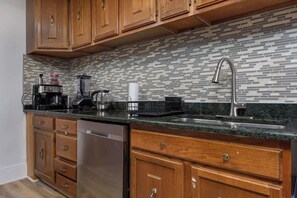 Microwave, dishwasher, coffee/tea maker, cookware/dishes/utensils
