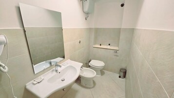 Classic Quadruple Room | Bathroom | Shower, hair dryer, towels, soap