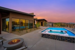 A modern house with a swimming pool, a fire pit, and a patio area. - Paradise Canyon-Heated Pool-Mountain View-Estate 1 (Fort Mcdowell)
