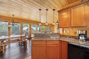 Fridge, dishwasher, coffee/tea maker, cookware/dishes/utensils