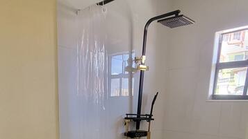 Shower, hair dryer, towels, soap