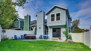 A two-story house with a backyard patio, outdoor seating, and a star decoration on the front door. - Mtn Views & Canyon Access: Cottonwood Heights Home (Salt Lake City)
