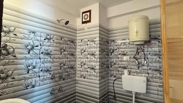 Shower, rainfall showerhead, towels, soap