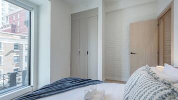 1 bedroom, desk, iron/ironing board, travel crib