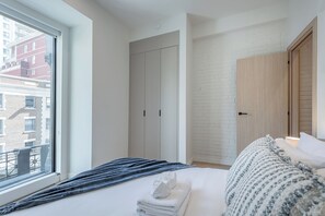 1 bedroom, desk, iron/ironing board, travel crib