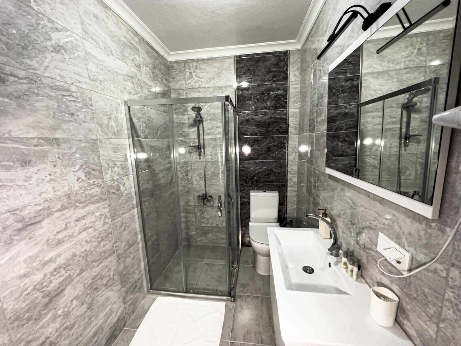 Shower, eco-friendly toiletries, hair dryer, towels