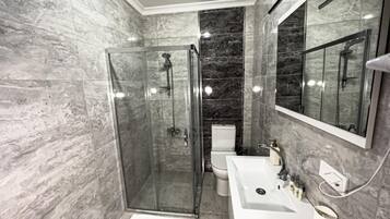 Shower, eco-friendly toiletries, hair dryer, towels