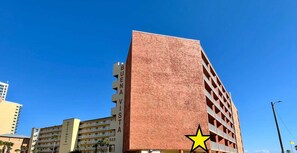 A multi-story building with a red facade, labeled "BUENA VISTA 633". - Buena Vista 105 2 Bedroom Townhouse (Gulf Shores)