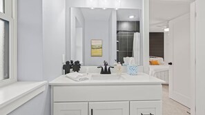 Shower, hair dryer, towels, soap - Gorgeous 5-bedroom, remodeled, historic home in Cedar Falls (Cedar Falls)