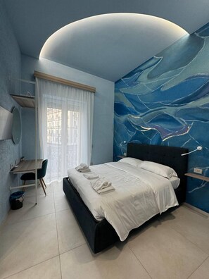 Deluxe Room, Balcony, City View | In-room safe, desk, iron/ironing board, free WiFi