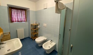 Deluxe Quadruple Room, Mountain View | Bathroom | Shower, free toiletries, hair dryer, slippers