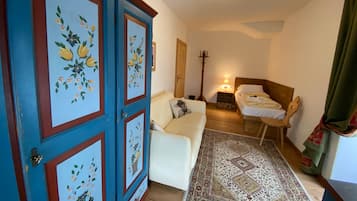 Deluxe Quadruple Room, Mountain View | In-room safe, desk, soundproofing, free cribs/infant beds