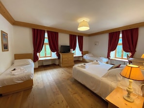 Deluxe Quadruple Room, Mountain View | In-room safe, desk, soundproofing, free cribs/infant beds
