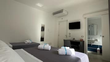Deluxe Triple Room, Balcony | Free minibar, desk, free WiFi, bed sheets