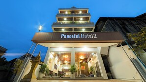 A multi-story building with a sign reading "Peaceful Hotel 2". - Peaceful 2 Hotel (Vientiane)