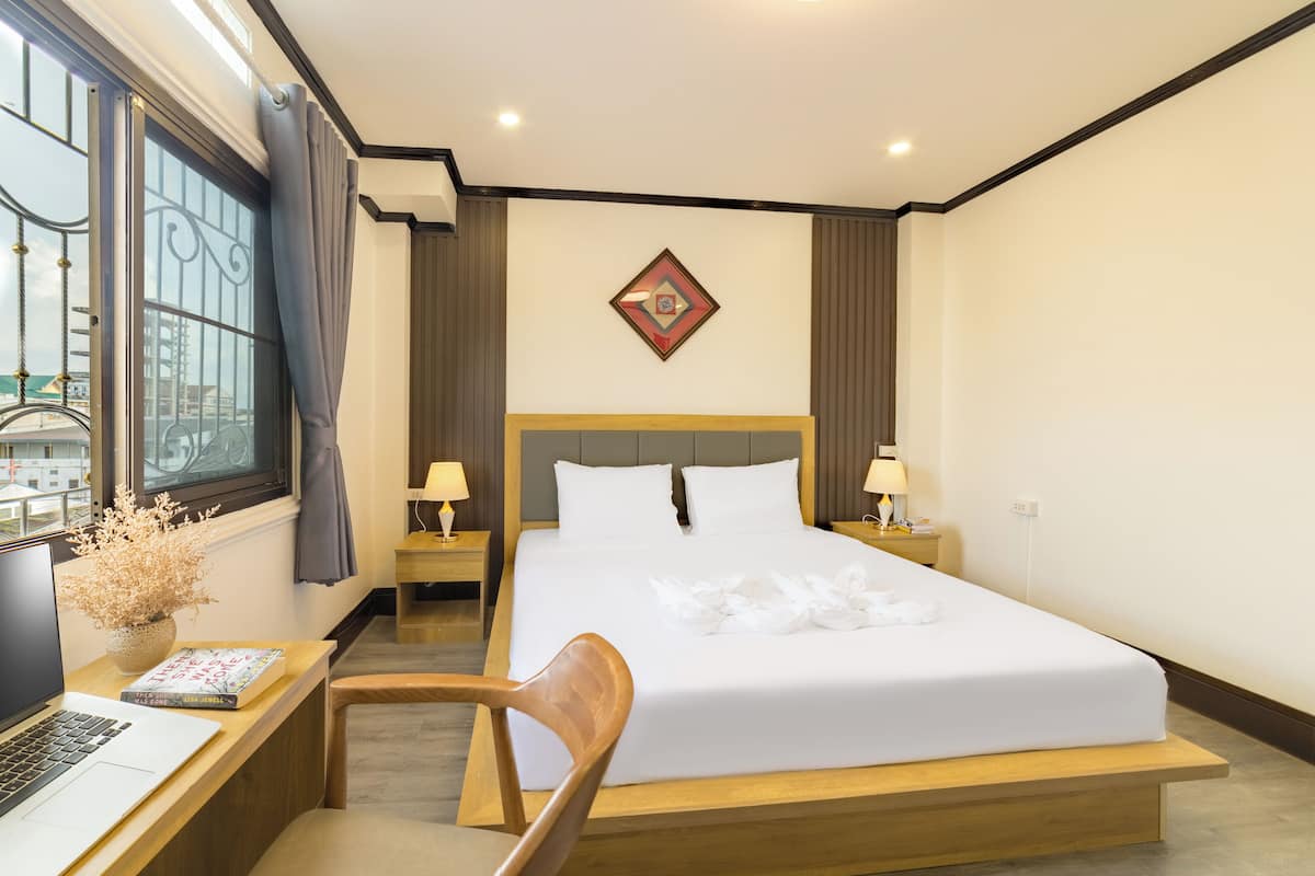 Classic Double Room, City View | Desk, laptop workspace, blackout drapes, iron/ironing board
