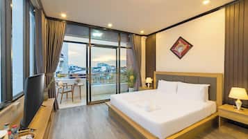 Deluxe Double Room, Balcony, City View | Desk, laptop workspace, blackout curtains, iron/ironing board