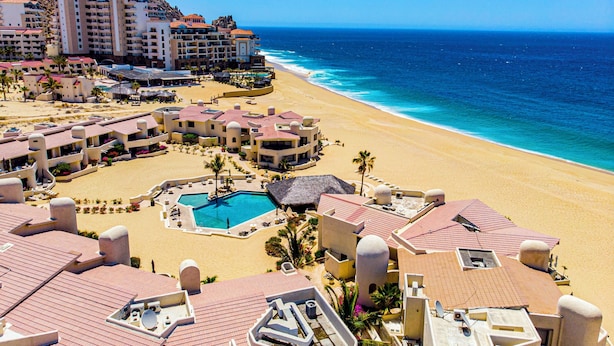 A resort with multiple buildings, a swimming pool, and a beach. - Terrasol Oceanview Condo with Patio (Cabo San Lucas)