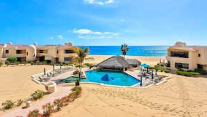 A resort with a pool, beach, and ocean view. - Terrasol Oceanview Condo with Patio (Cabo San Lucas)