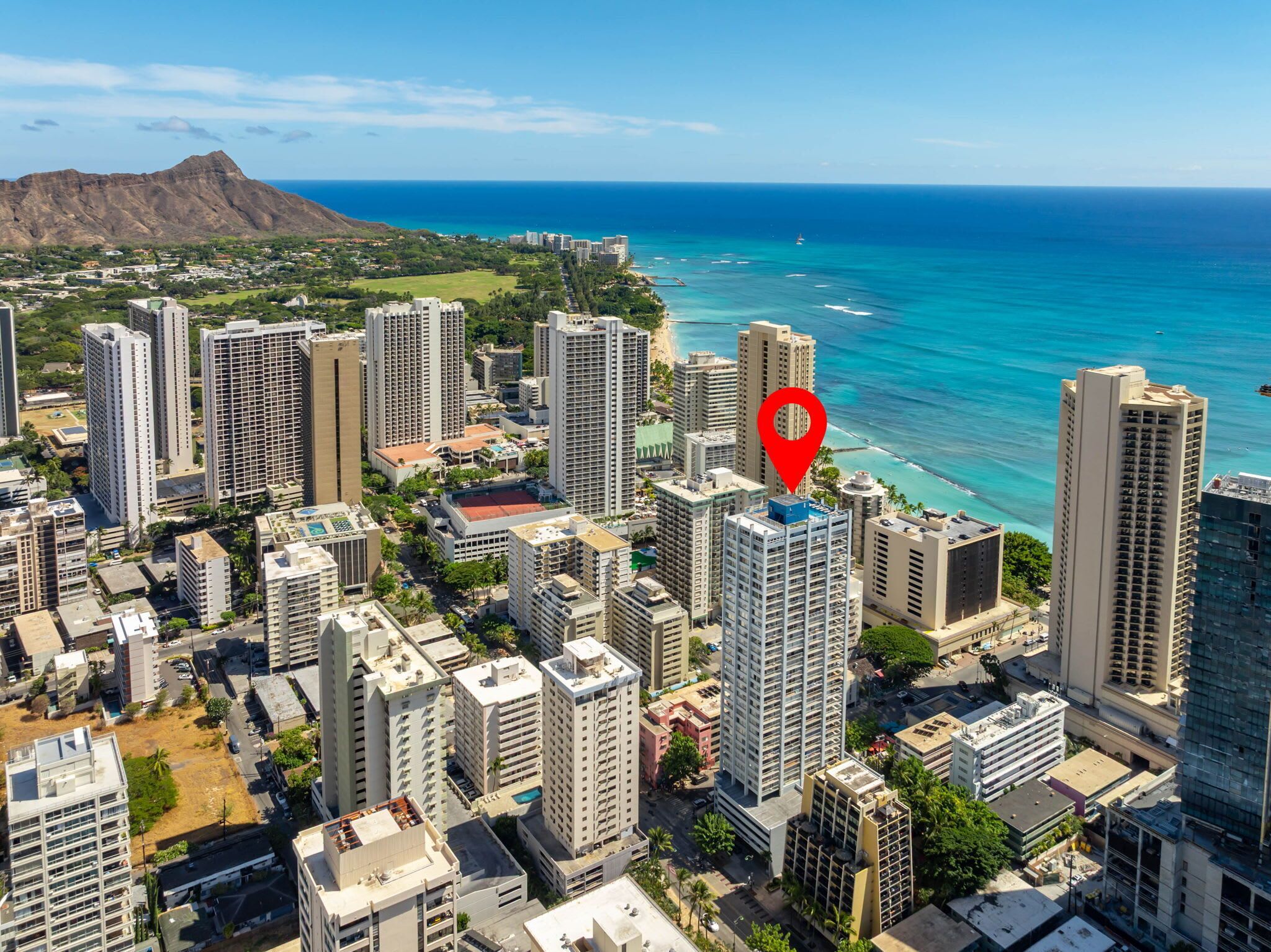 A high-rise urban area with a prominent red location marker.