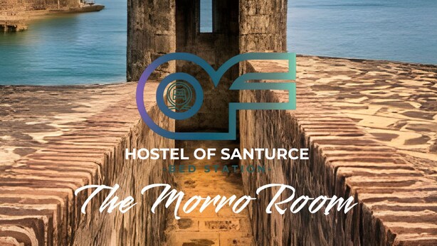 A historic stone structure with a dome, located near a body of water, labeled as "Hostel of Santurce The Monro Room".