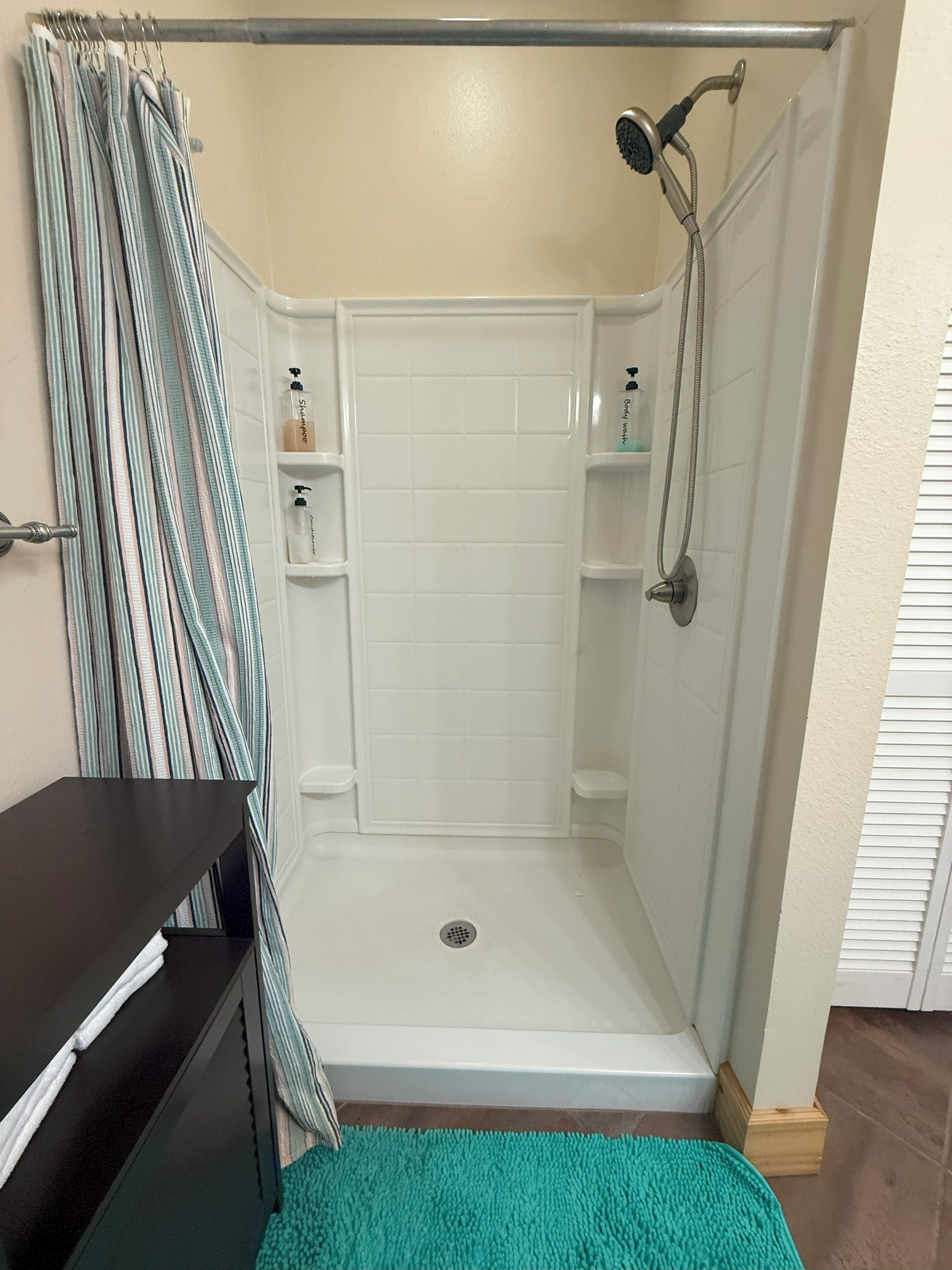 Shower, hair dryer, towels, soap