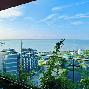 A high-rise building with a view of the sea and other buildings. - FLAMINGO HAI TIEN-SEA VIEW (Hoang Hoa)
