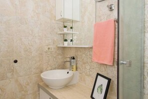 Shower, hair dryer, towels, soap