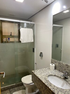 Shower, hair dryer, towels, toilet paper