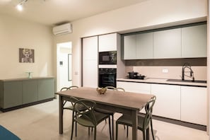 Deluxe Apartment, Balcony | Living area