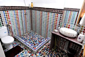Shower, towels, soap, toilet paper