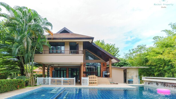 A two-story house with a swimming pool, surrounded by lush greenery. - Peaceful Resort-Style pool villa in Doi Saket, Chiang Mai (Tambon Choeng Doi)