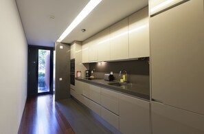 Fridge, coffee/tea maker, cookware/dishes/utensils